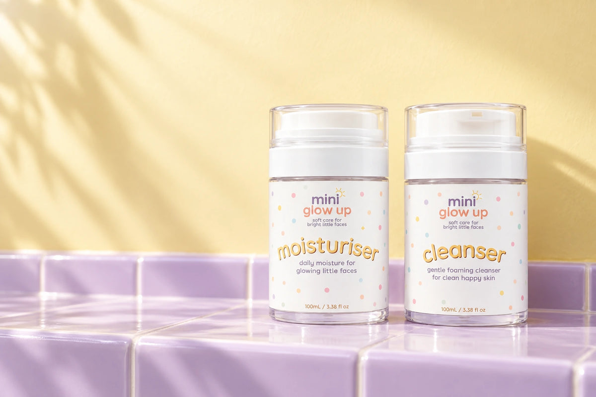 Mini Glow Up cleanser and moisturiser on sunlit lilac tiles